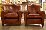 Pair of vintage French leather club chairs with - chapeau gendarme on Sale