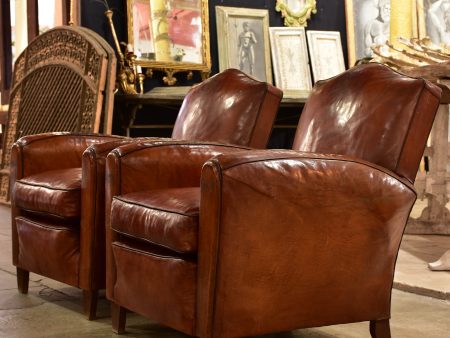 Pair of vintage French leather club chairs with - chapeau gendarme on Sale