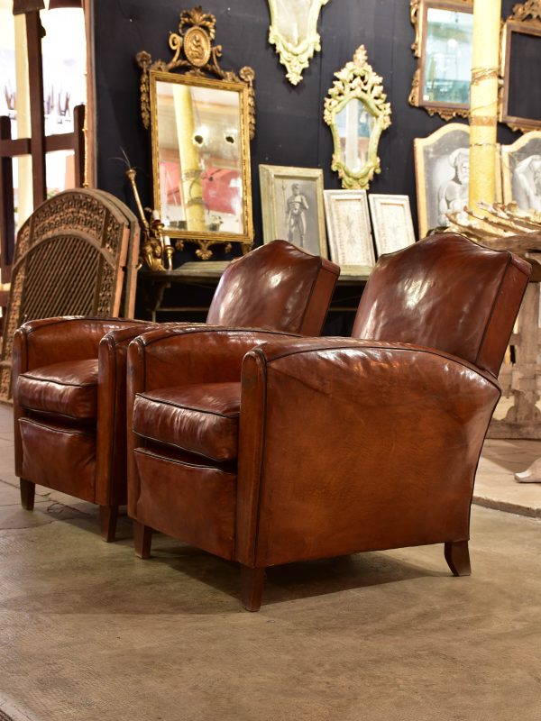 Pair of vintage French leather club chairs with - chapeau gendarme on Sale